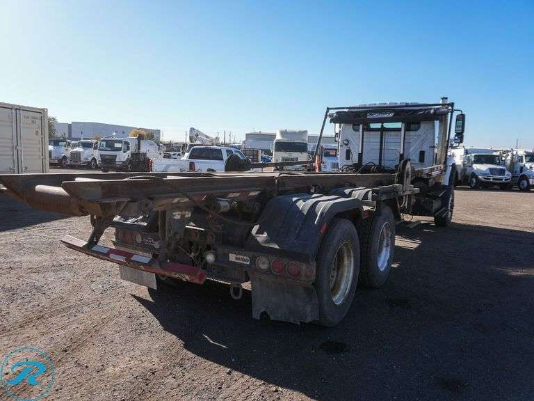 2011  International  Workstar 7600  T/A Rolloff Truck - Roller Auctions