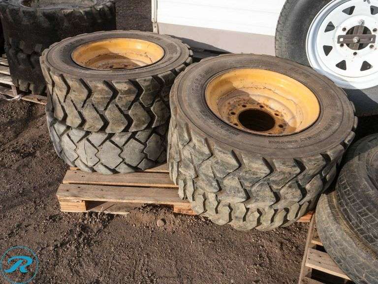 Set of (4) Used 10-16.5 Skid Steer Tires w/ Wheels - Roller Auctions