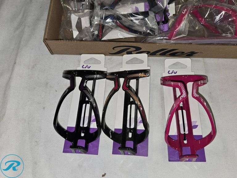 Tray of Liv Branded Bicycle Bottle Cages in Various Colors - Roller Auctions