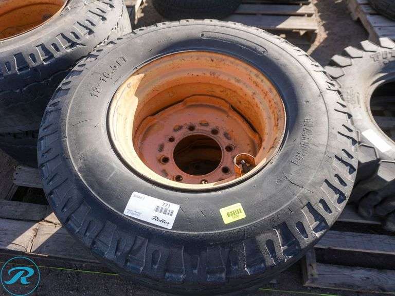 Set Of (4) Used 12-16.5 Skid Steer Tires w/ Wheels, Foam Filled - Roller Auctions