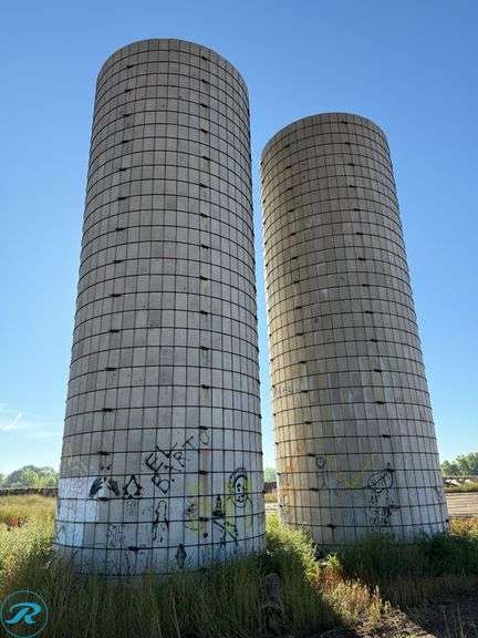 (2) Concrete Stave Silos, 40' Height, 44' Circumference, 14' Internal Diameter, On Concrete Foundations (No Roofs) - Roller Auctions