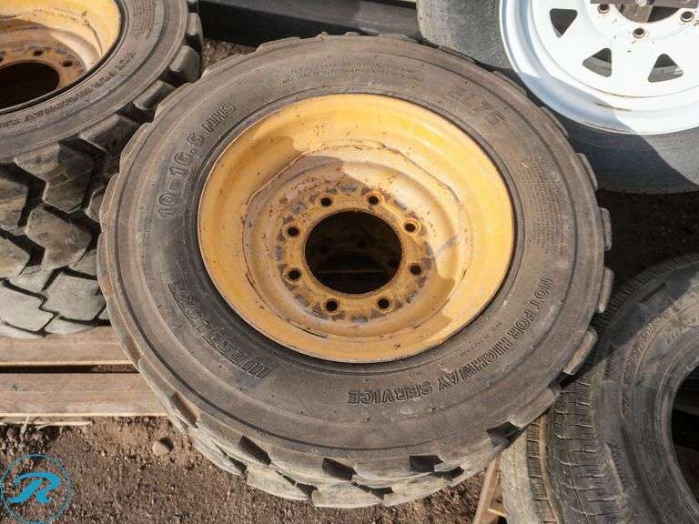 Set of (4) Used 10-16.5 Skid Steer Tires w/ Wheels - Roller Auctions