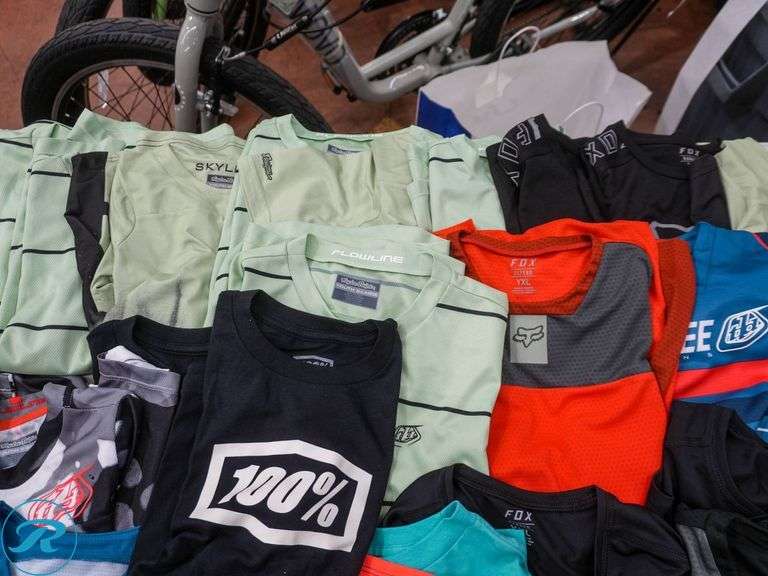 Crate of (47) Youth Cycling Shirts, Assorted Brands and Sizes - Roller Auctions