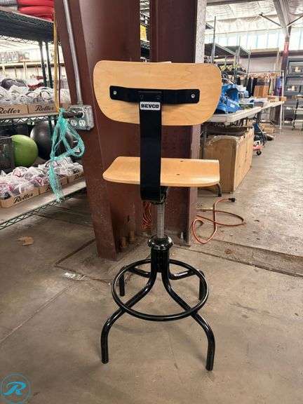 Bevco Adjustable-Height Industrial Stool with Wood Seat and Backrest - Roller Auctions