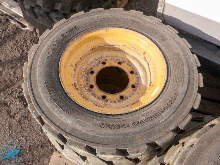 Set of (4) Used 10-16.5 Skid Steer Tires w/ Wheels - Roller Auctions