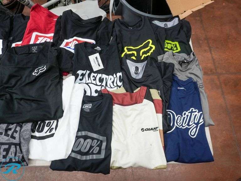 Crate of (56) Men's Cycling Shirts, Size M, Assorted Brands - Roller Auctions