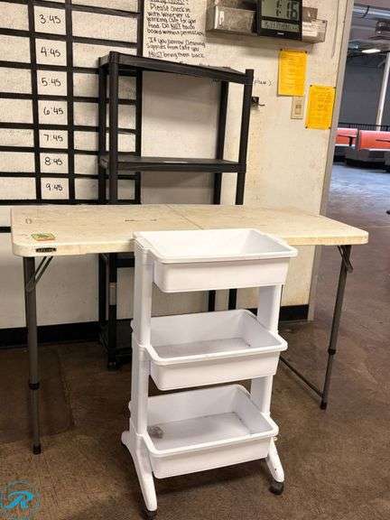 Folding Table, White Plastic Rolling Cart, and Black Plastic Shelving Unit