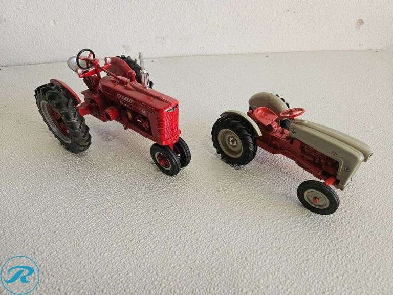 (2) Diecast Model Tractors: McCormick Farmall and Ford Tractor - Roller Auctions
