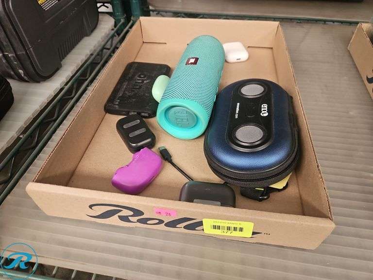 Tray of Bluetooth Speakers and Headphones