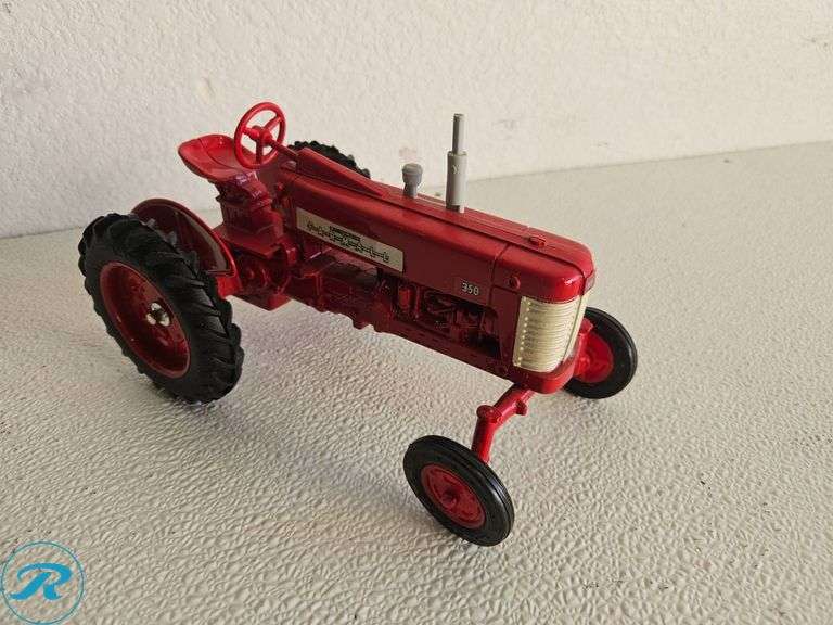 (2) Diecast Model Tractors: McCormick Farmall and International 350 Tractor Models - Roller Auctions