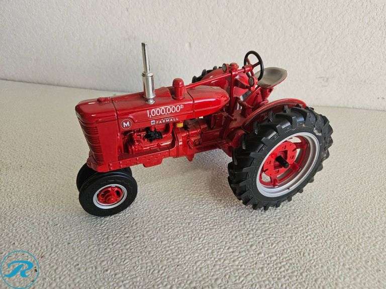 (2) Diecast Model Tractors: McCormick Farmall and Ford Tractor - Roller Auctions