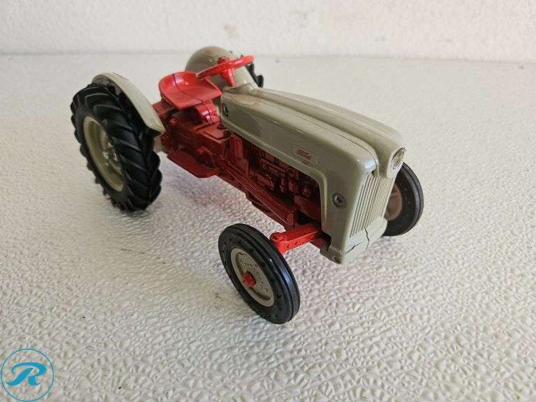 (2) Diecast Model Tractors: McCormick Farmall and Ford Tractor - Roller Auctions