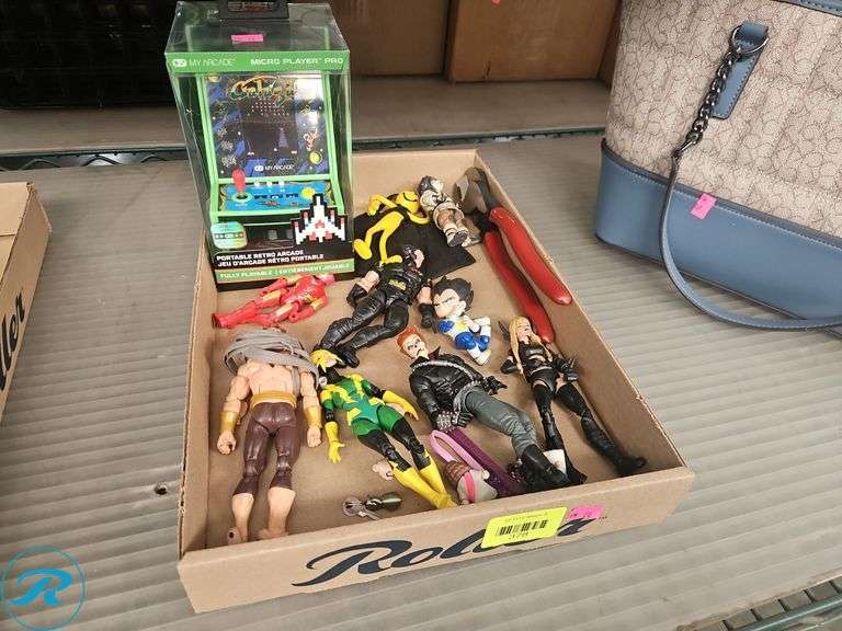 Tray of Action Figurea and Galaga Portable Retro Arcade