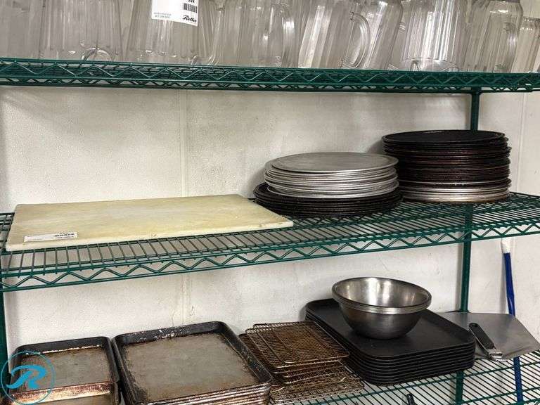 Shelf of Pizza Pans and Cutting Board