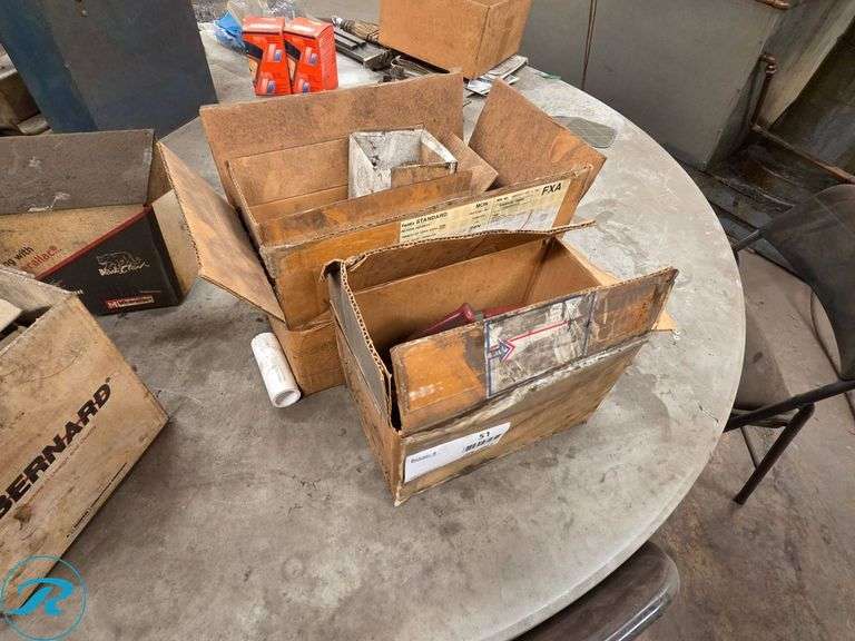 Vertical Toggle Clamps in Cardboard Boxes