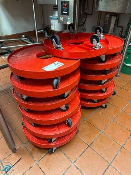 Stacked Red Keg Dollies with Swivel Casters