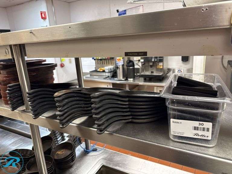 (31) Cast Iron Skillets and (60) Wooden Serving Trays - Roller Auctions