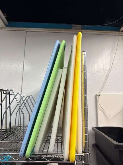Metal Rack with Assorted Plastic Cutting Boards - Roller Auctions