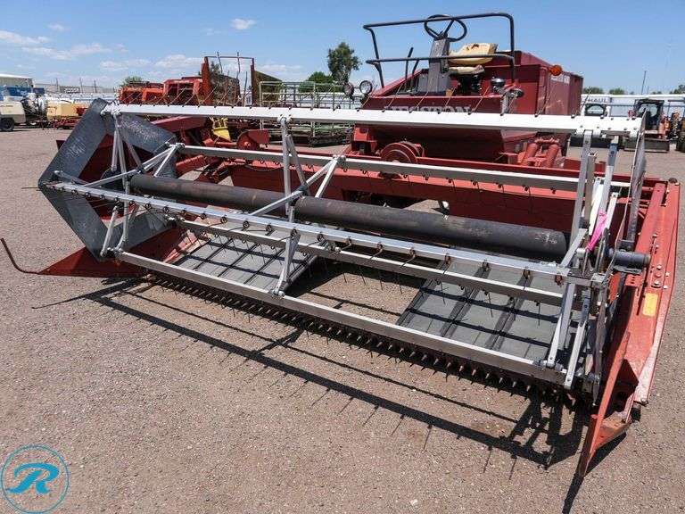 Heston 6450 Swather, ( Unit has a Blown Hydraulic Hose And Needs Replaced) - Roller Auctions