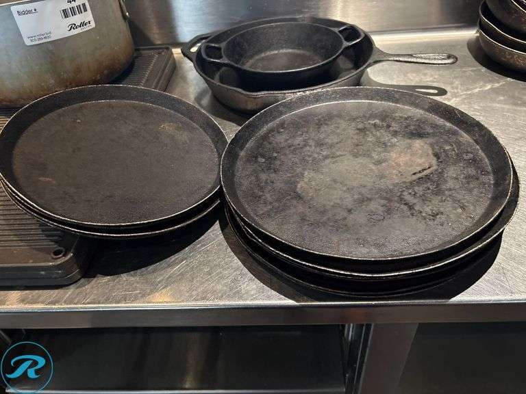 Cast Iron Pans, Sizzle Plates, (2) Griddle Pans, and Aluminum Pot - Roller Auctions