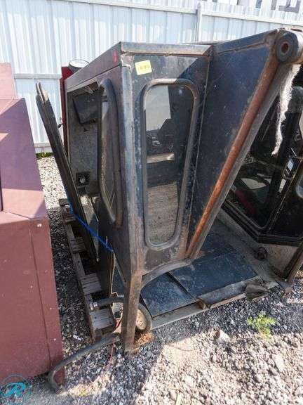 Cozy Tractor Cab with Glass Panels - Roller Auctions