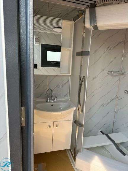 New Bastone Portable Bathroom With Sink, Toilet and Shower, 110V, Forklift Pockets - Roller Auctions