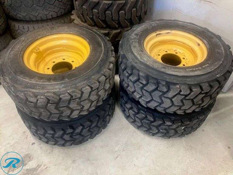 (4) John Deere 16.5 x 9.75 325 Skid Steer