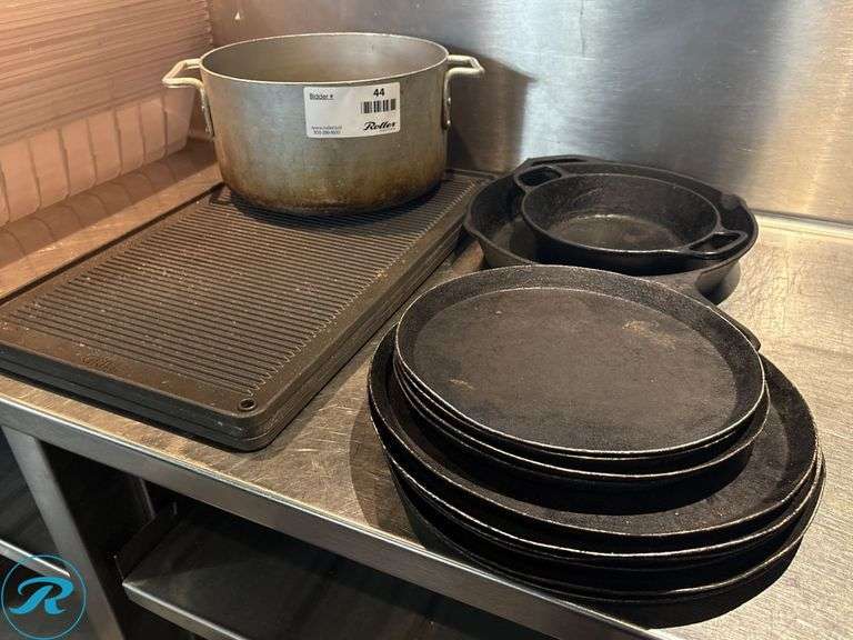 Cast Iron Pans, Sizzle Plates, (2) Griddle Pans, and Aluminum Pot - Roller Auctions