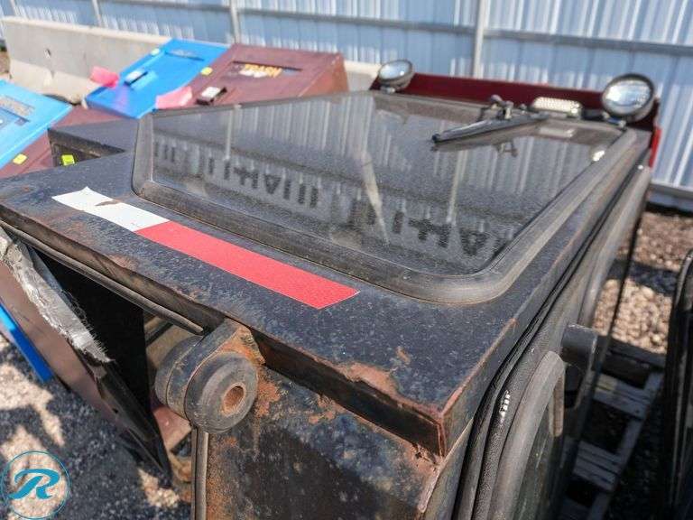 Cozy Tractor Cab with Glass Panels - Roller Auctions