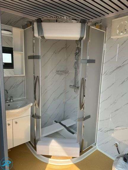 New Bastone Portable Bathroom With Sink, Toilet and Shower, 110V, Forklift Pockets - Roller Auctions