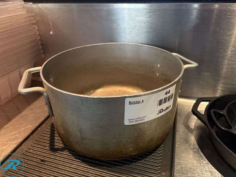 Cast Iron Pans, Sizzle Plates, (2) Griddle Pans, and Aluminum Pot - Roller Auctions