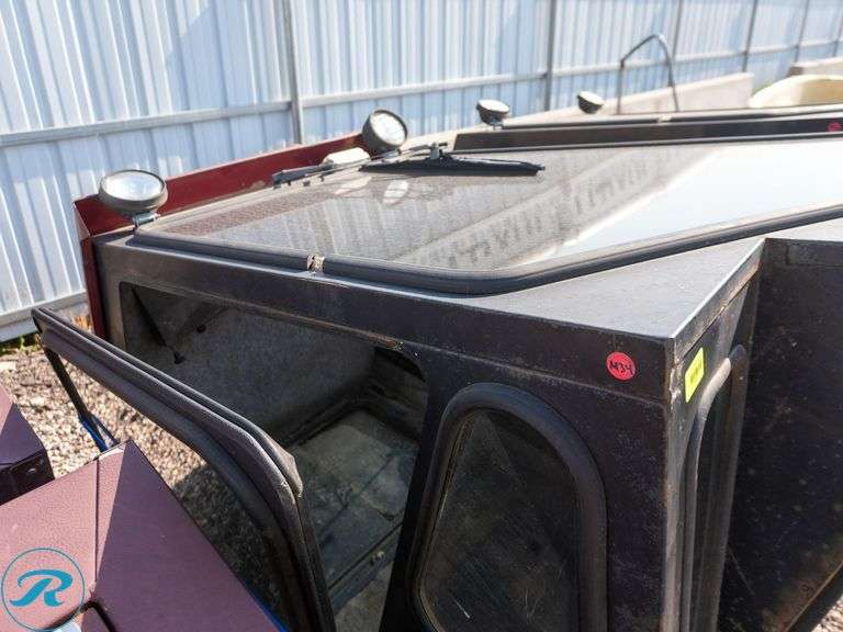 Cozy Tractor Cab with Glass Panels - Roller Auctions