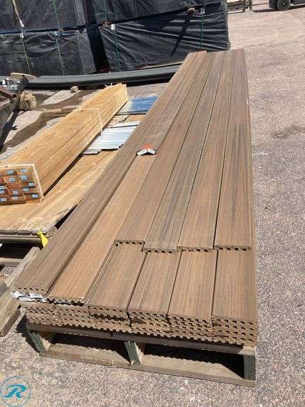 (37) New- (33) Trex Enhance Natural 1" x 6" x 16ft Toasted sand Grooved Composite Deckboard (4) Trex Enhance Naturals 1" x 6" x 15ft Toasted Sand Grooved Composite Deckboard (one board has an orange paint stain) - Roller Auctions