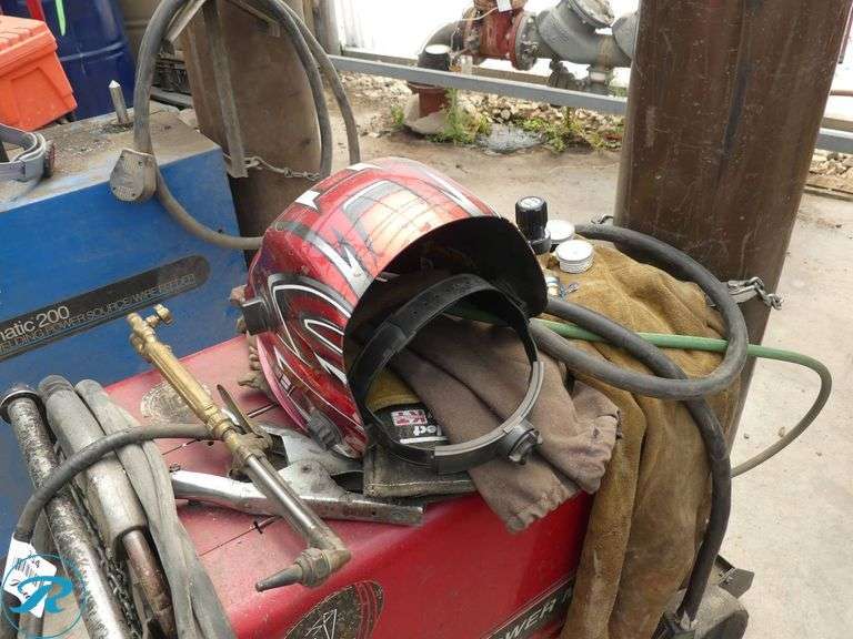 Lincoln Electric Power MIG 255 Mig Welder with Gas Cylinders and Helmet, 208/230V, Single Phase - Roller Auctions