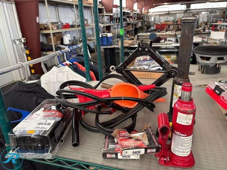 Automotive Tools and Accessories Lot Including Bottle Jack, Jack Stand, Tint Film Application Kit, and Spark Plugs