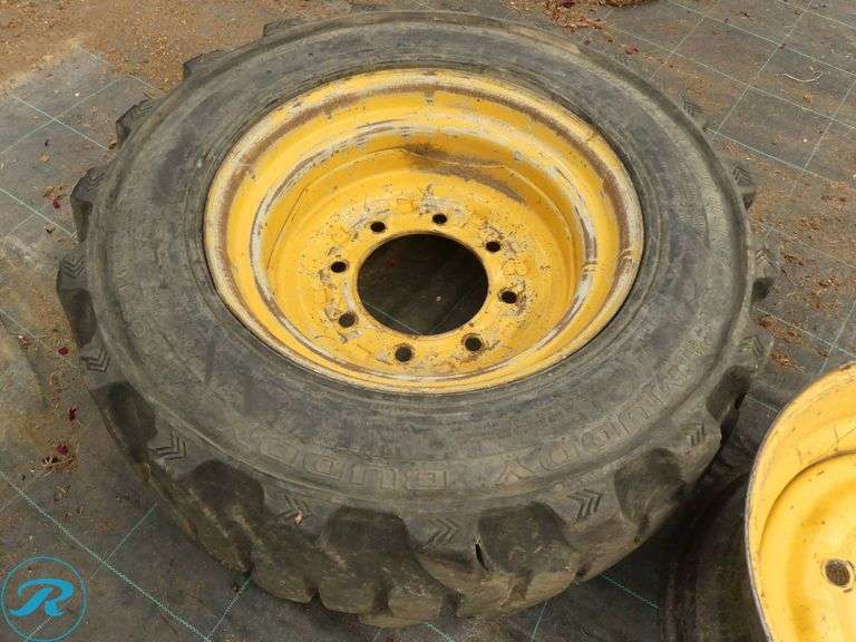 Galaxy Mud Buddy 10 x 16.5 Skid Steer Tire With (2) Wheels to Fit Caterpillar - Roller Auctions