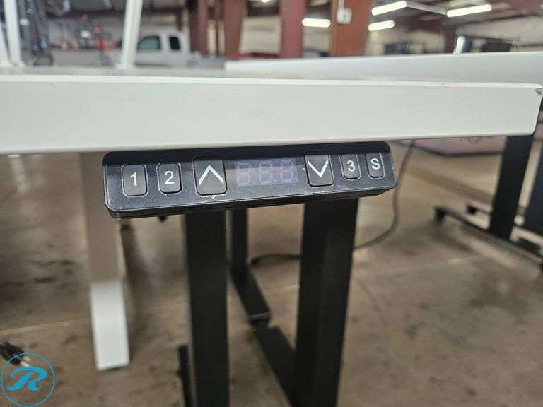Electric Height-Adjustable Desk with White Top and Black Base, 60×30 Inches - Roller Auctions