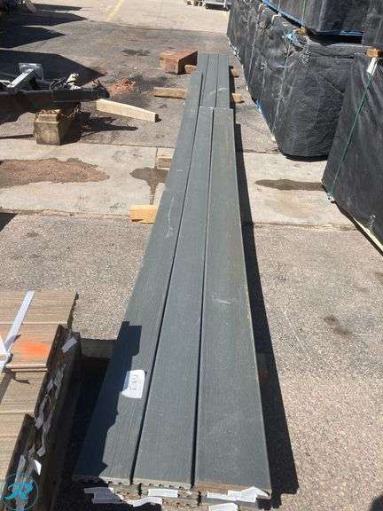 (13) New- (9) Trex Enhance basic 1" x 6"  x 20 ft Clam Shell grooved composite deckboard (2) Trex Enhance basic 1" x 6"  x 12 ft Clam Shell grooved composite deckboard (2) Trex Enhance basic 1" x 8"  x 12 ft Clam Shell grooved fascia deckboard - Roller Auctions
