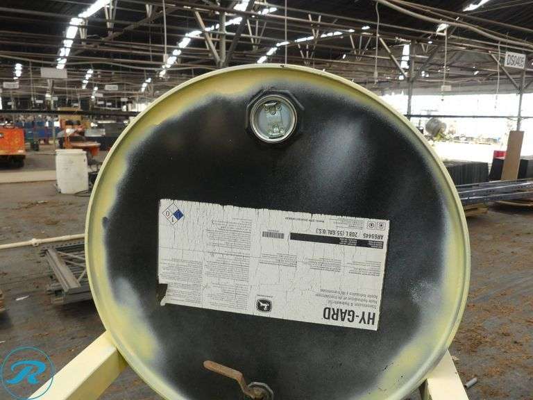 Drum Dispenser Stand with 55-Gallon Drum of John Deere Hydraulic Fluid (1/4 Full) - Roller Auctions