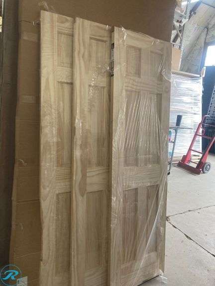 (3) New- Reliabilt 24" x 80" 6-panel solid core unfinished pine wood door (all 3 have damage on side see photos) (Total of 3 doors) - Roller Auctions