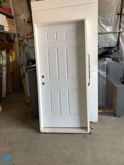 (1) New- Reliabilt 36" x 80" x 6 9/16" Steel no glass right hand Inswing primed prehung front door with Brickmould insulating core (some damage in frame see Photos) (Total of 1) - Roller Auctions