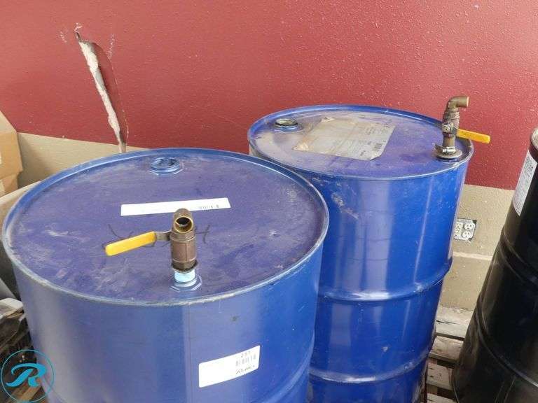 (4) 55-Gallon Drums With Ball Valve Dispensers, (3) Empty and Valvoline Hydraulic Oil 3/4 Full - Roller Auctions