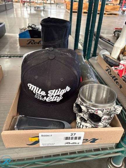 Tray of Bluetti Handheld Vacuum, Braun S3 Electric Razor, Skull Mug, Winter Hat, Goggles, and Two Baseball Caps