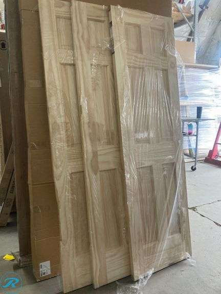 (3) New- Reliabilt 24" x 80" 6-panel solid core unfinished pine wood door (all 3 have damage on side see photos) (Total of 3 doors) - Roller Auctions