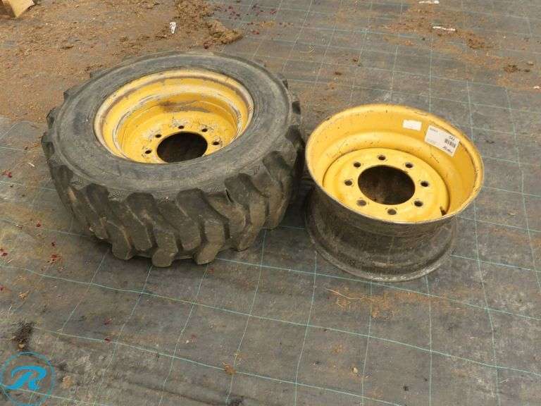 Galaxy Mud Buddy 10 x 16.5 Skid Steer Tire With (2) Wheels to Fit Caterpillar - Roller Auctions