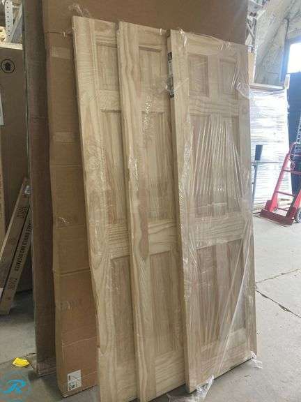(3) New- Reliabilt 24" x 80" 6-panel solid core unfinished pine wood door (all 3 have damage on side see photos) (Total of 3 doors) - Roller Auctions