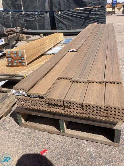 (37) New- (33) Trex Enhance Natural 1" x 6" x 16ft Toasted sand Grooved Composite Deckboard (4) Trex Enhance Naturals 1" x 6" x 15ft Toasted Sand Grooved Composite Deckboard (one board has an orange paint stain) - Roller Auctions