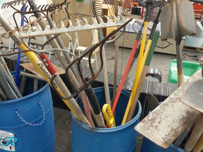 (3) Barrels of Garden and Yard Tools Including Rakes, Shovels, and Hoes - Roller Auctions