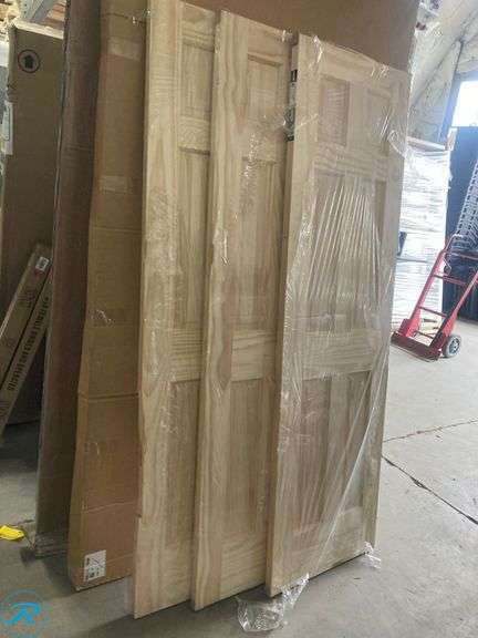 (3) New- Reliabilt 24" x 80" 6-panel solid core unfinished pine wood door (all 3 have damage on side see photos) (Total of 3 doors) - Roller Auctions