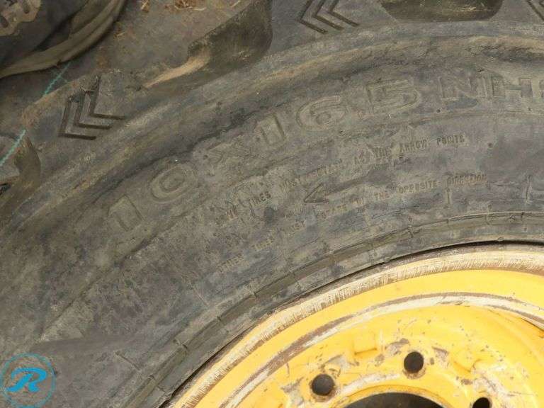 Galaxy Mud Buddy 10 x 16.5 Skid Steer Tire With (2) Wheels to Fit Caterpillar - Roller Auctions